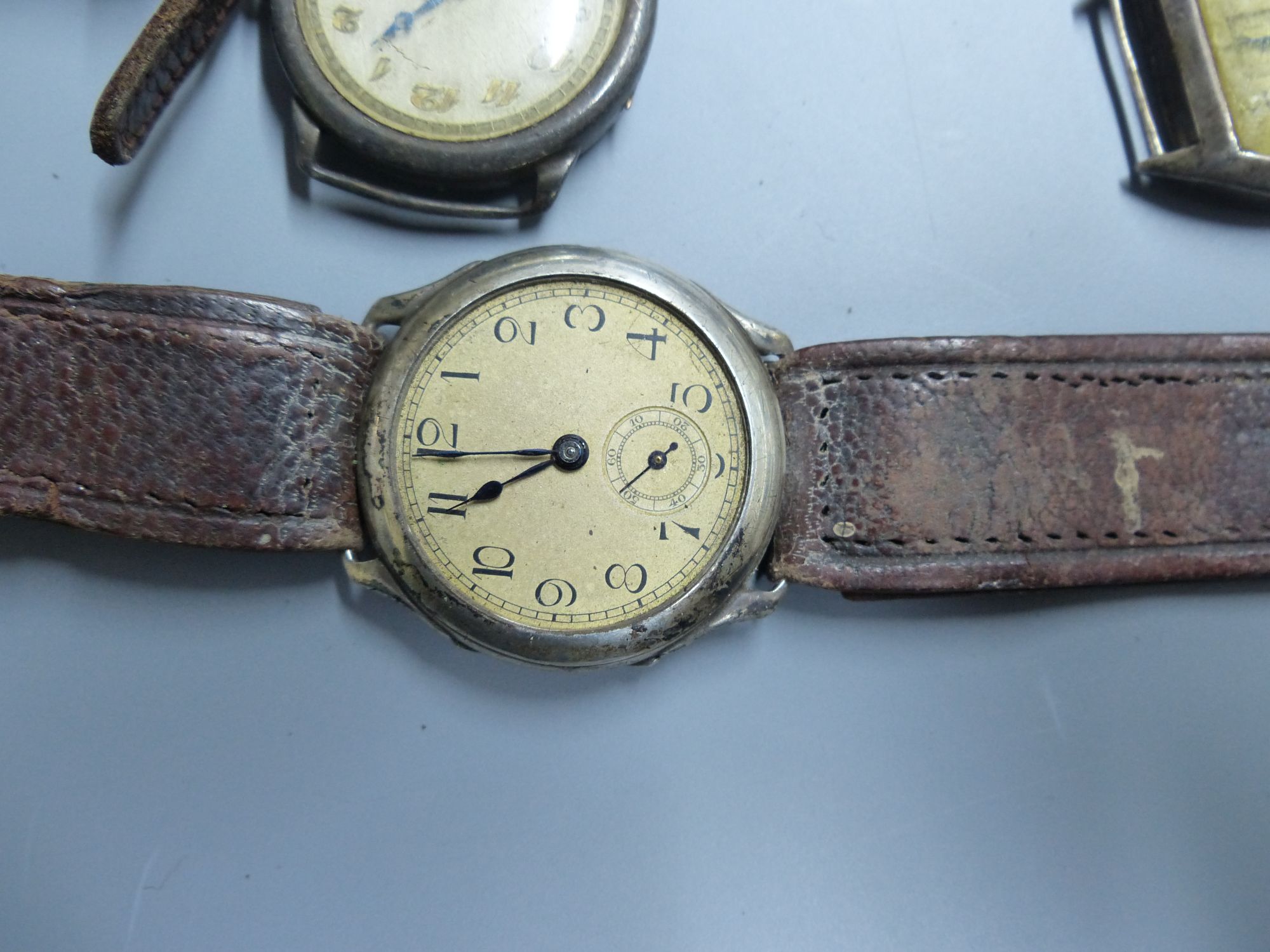 Eight assorted early to mid 20th century silver and white metal wrist watches (a.f.).